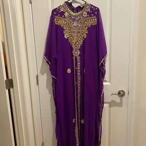 Purple high necked bejeweled kaftan.